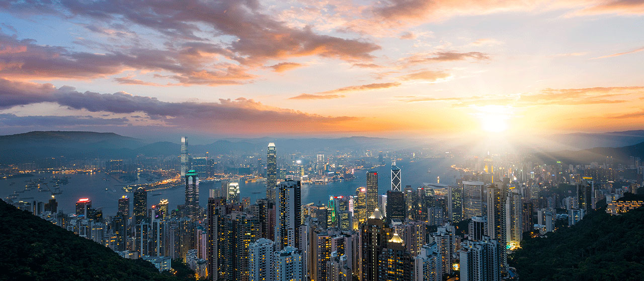 Cityscape with high-rise buildings at sunrise 