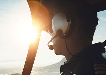 Pilot in flight overlooking the horizon&nbsp;
