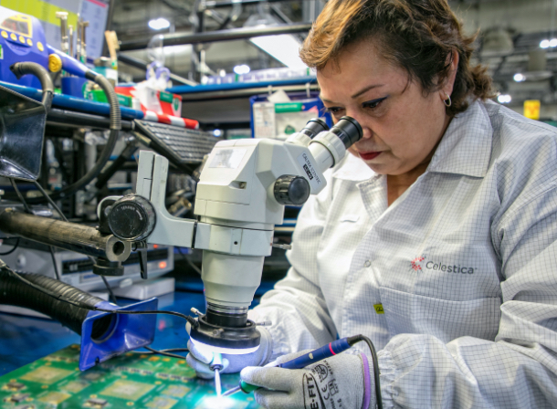 Celestica employee working on a board