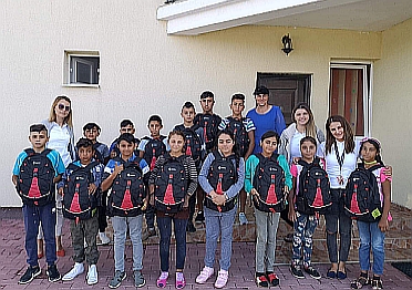 Celestica Oradea employees donating school supplies and backpacks.