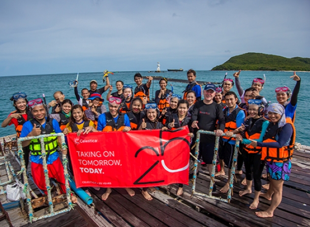 Celestica employees doing coral reef restoration work.