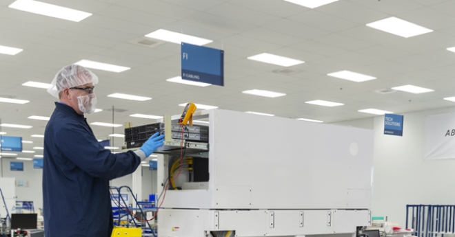 Celestica employee in a electronics lab.