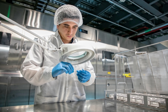 Celestica health tech employee working in a level 6 clean room